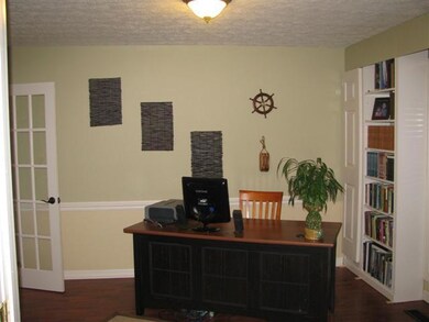 Formal Dining Area currently being used as Home Office with Built In Book Shelves