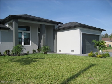 View of front of property featuring a garage and a