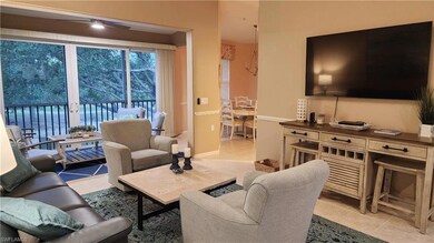 Living room featuring light tile patterned floors and baseboards