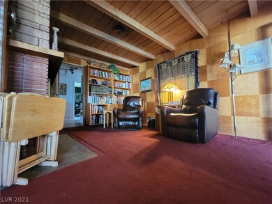 Library with wood-burning fireplace and built-in b