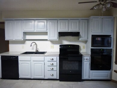 Kitchen complete with double ovens for the upcomin
