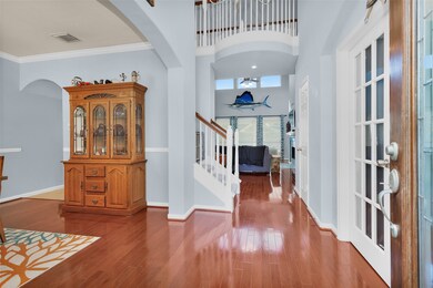 When you walk in through your new front door there is so much to take in. First you will notice the 2 story entry with an upstairs catwalk and the beautiful wood floors, then you will notice the openness of the living room and straight through that wall of windows in the back is your backyard oasis. To the left is your formal dining area and to the right are the paned, double doors leading into your large office.