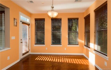 Light and airy Breakfast area with a door leading 