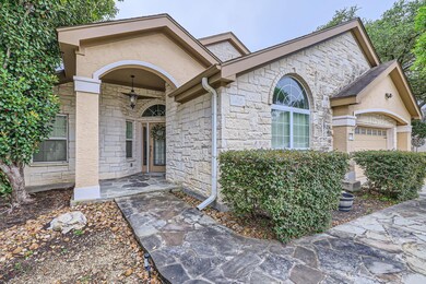 Doorway to property featuring stone siding, an at