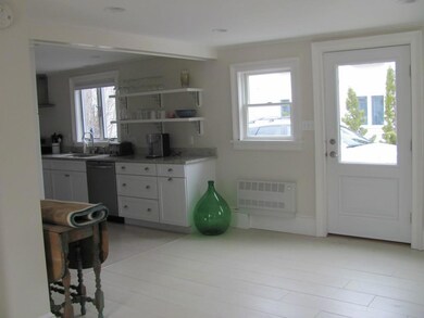 Entry area looking toward kitchen.