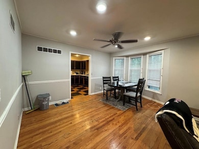 Dining room featuring light wood finished floors, a ceiling fan, and recessed lighting