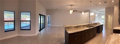LOOKING THROUGH DINING NOOK TO GREAT ROOM AND KITCHEN AT 2906 SE 8TH AVE