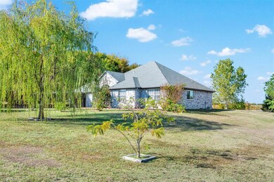 Trees are found on all sides of the property surro