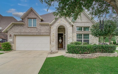 Manicured hedges are bordered by landscape rock an