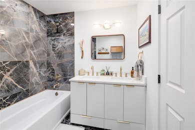Bathroom with a sink, double vanity, and shower /