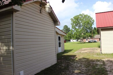 View of area between house & garage/workshop