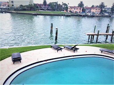 View from master bedroom of pool and water.