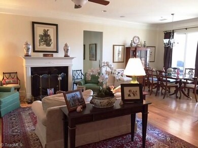 Living room, open to formal dining room!  Gas log fireplace.  Hallway leads to laundry room and bedrooms.