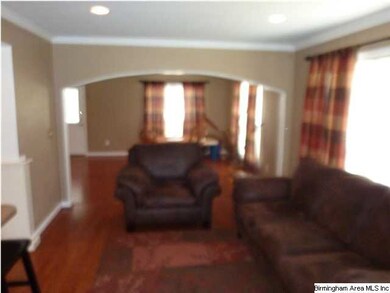 Living room welcomes and is open to both the updat