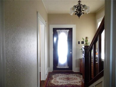 Formal entry with gleaming wood floors. All area c