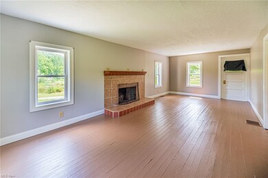 Living room with fireplace and painted wood floor