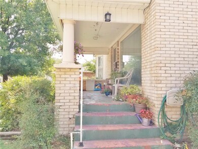 Covered front porch ready for you to sit and enjoy