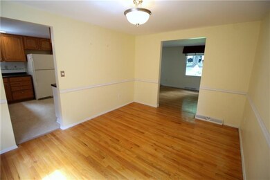 The dining room also features exposed hardwood flo
