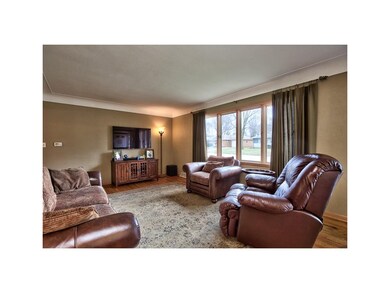 Living room offers tons of natural light and hardw