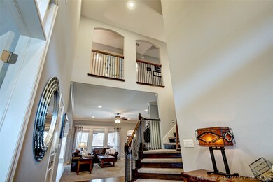 Welcoming entrance with balcony overlooking foyer.
