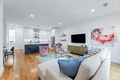 Living room with light hardwood / wood-style floor