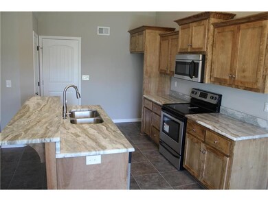 Standard kitchen on a similar home.  Kitchen islan