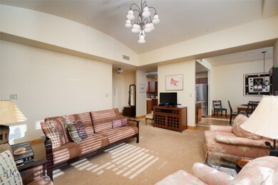 Living room looking toward kitchen and entryway