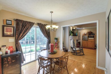 Eat In Kitchen Area With Large Glass Doors Leading Out To The Back Patio. 