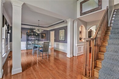 Foyer, hallway, stairway and view into Dining Room