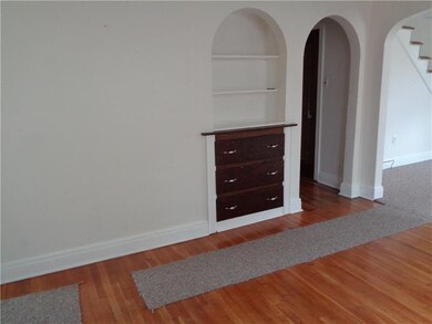 DINING ROOM WITH BUILT-INS AND HARDWOOD FLOORS~