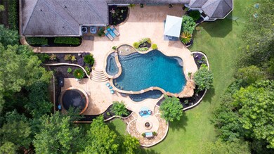 This aerial view showcases a luxurious backyard fe