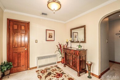 Foyer with access to full attic with fixed stairs.