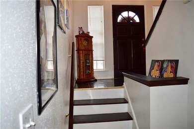 STAIRS LEADING DOWNSTAIRS AS YOU ENTER THE HOME