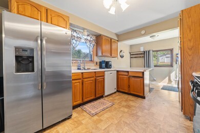 Kitchen featuring white dishwasher, stainless stee
