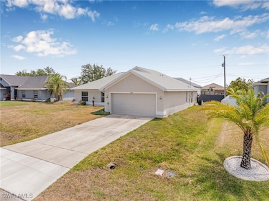 Single story home with a garage, stucco siding, an