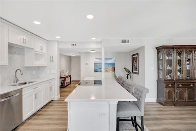 the kitchen is open to the dining area and living area