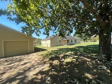 View of yard with a garage