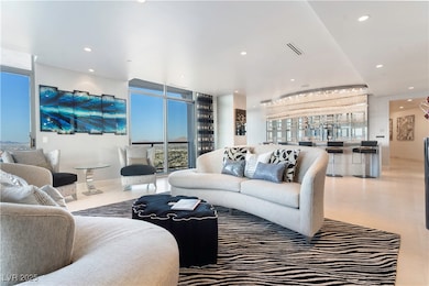 Tiled living area featuring plenty of natural ligh