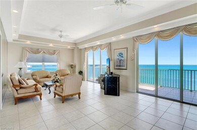 Living room with a ceiling fan, light tile pattern