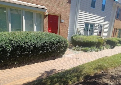 View of exterior entry with brick siding