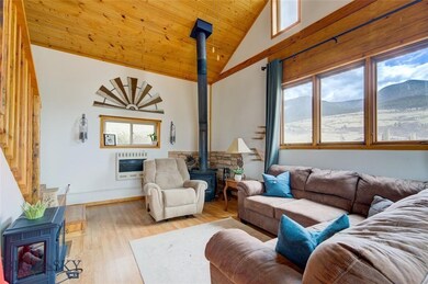 Living Room - Gas wall heater & wood 
stove. - Ph