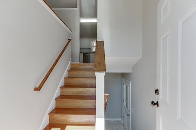 Staircase featuring visible vents