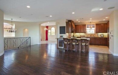 Looking into open kitchen and formal dining