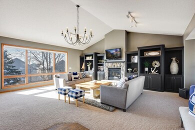 The stone fireplace, vaulted ceiling and plush car