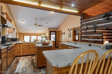 Gormet Kitchen, With Custom Hand Made Solid Oak Cabinets, Premium Stainless Stell Appliances, Premium LVT Flooring, Breakfast Bar, Large Pantry, French Doors to Deck, Custom Lighting