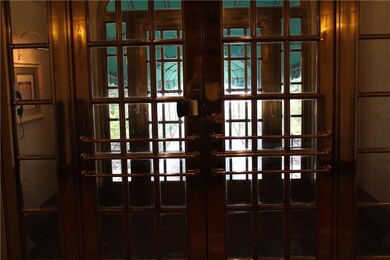 Grand Entrance with original Double Brass Doors We