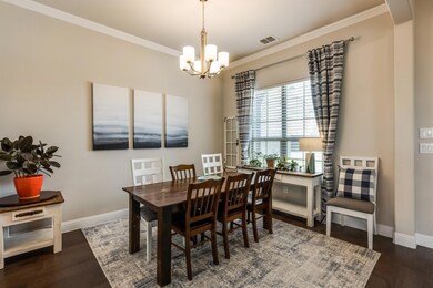 Formal dining with crown moulding and has access t