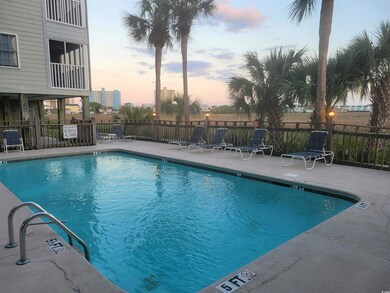 Villa Pool at dusk featuring a patio area