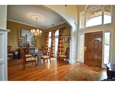 Smooth ceilings and custom window treatments gives