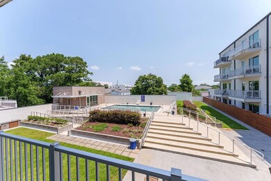which overlooks a stunning pool and outdoor space.